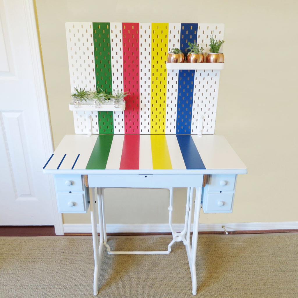 Upcycle a Singer sewing machine table into a Hudson’s Bay point blanket inspired desk. Skadis pegboard | Birdz of a Feather | Singer sewing machine table | Upcycled furniture | Painted furniture | Point blanket decor | Hudsons Bay point blanket | Point blanket stripes | Ikea Ideas | Ikea DIY | Ikea office hack | Ikea office decor | #pointblanket #paintedfurniture #vintagefurniture #Singersewingmachine #sewingmachinetable #Ikeahack #Skadis #pegboard | BirdzofaFeather.ca