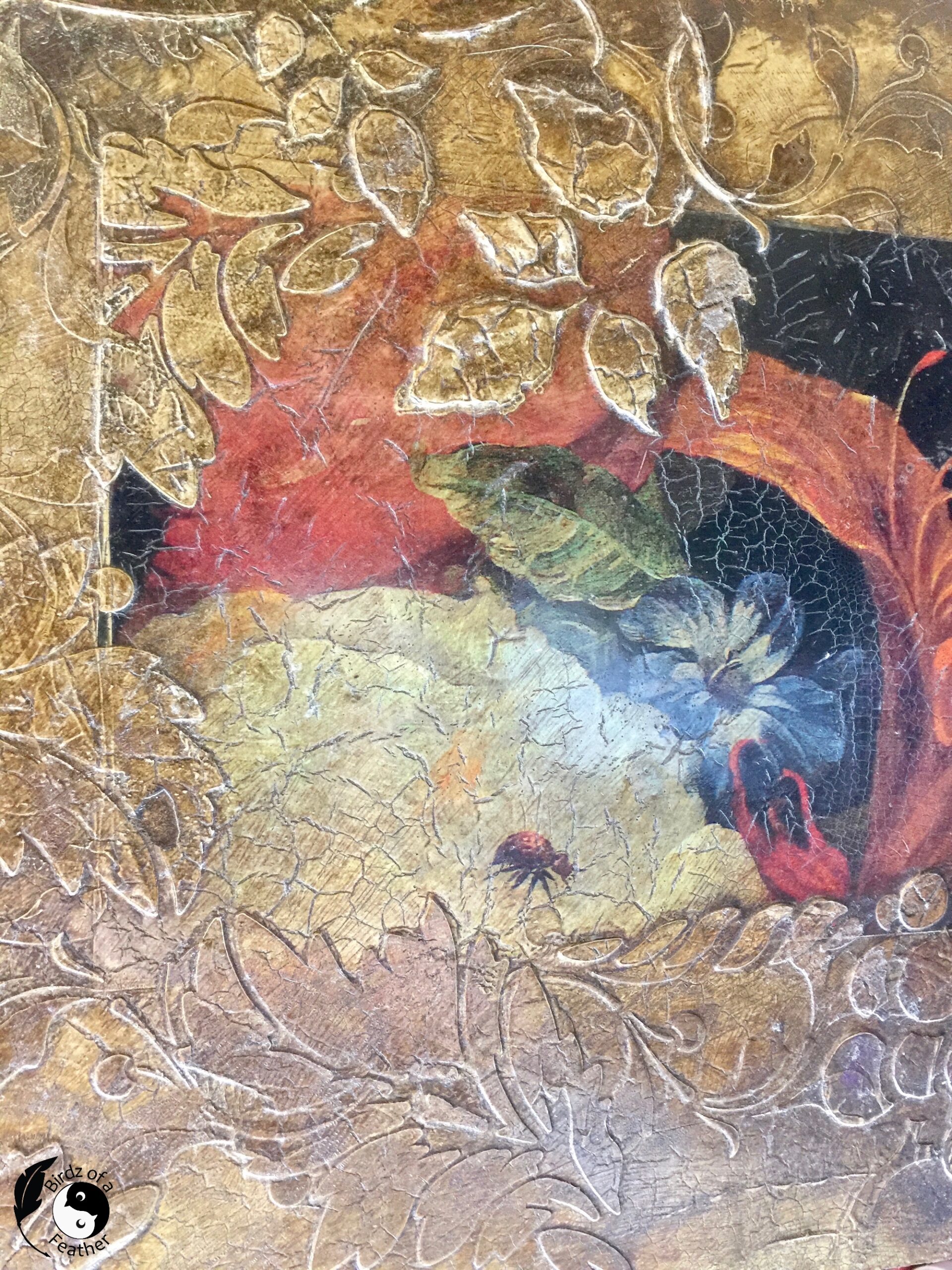 Decoupage on wood shows decoupage paper with a peony and ladybug and various other flowers