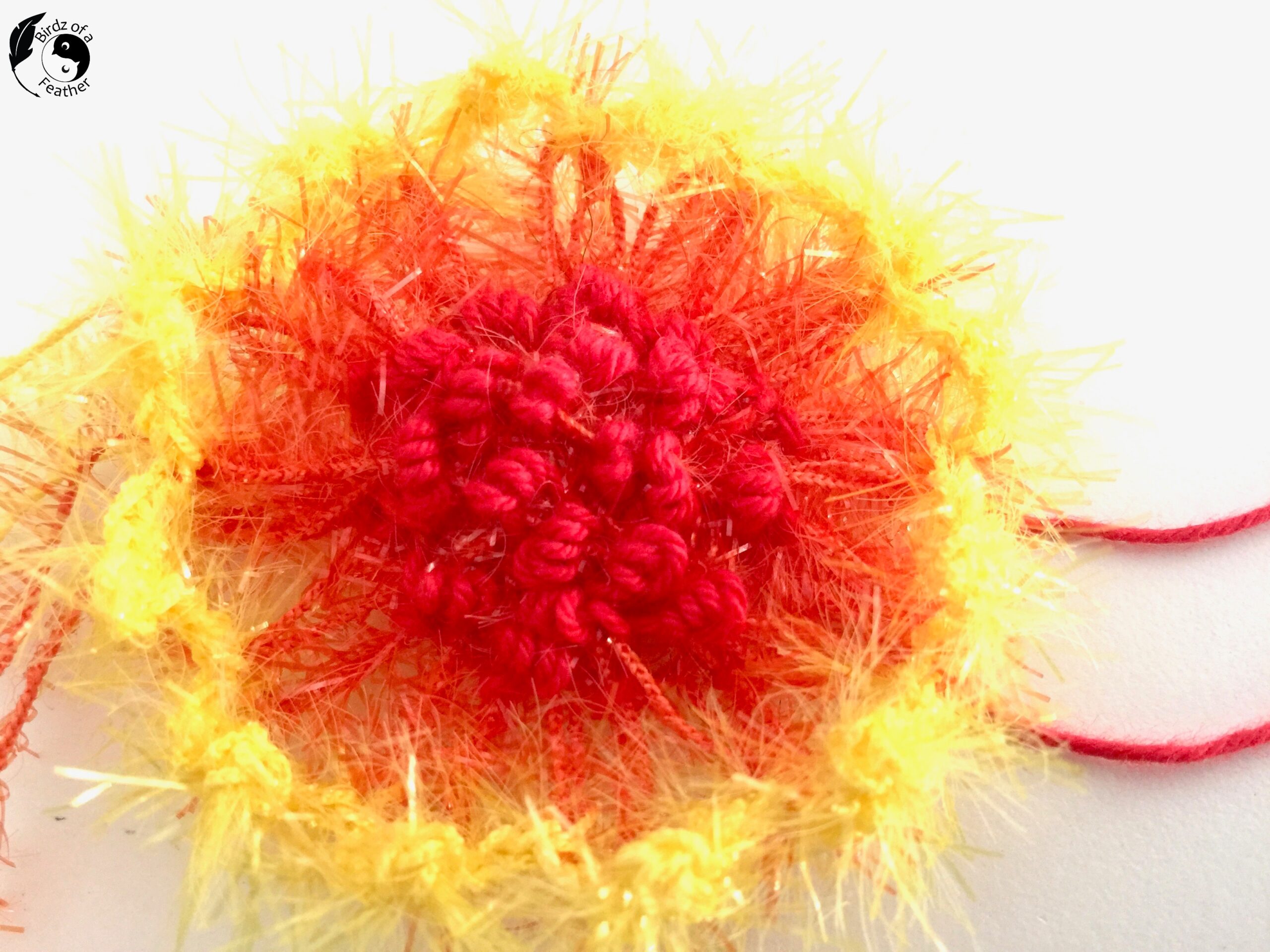 Closeup of embroidery on crazy daisy creation for Crochet coral reef