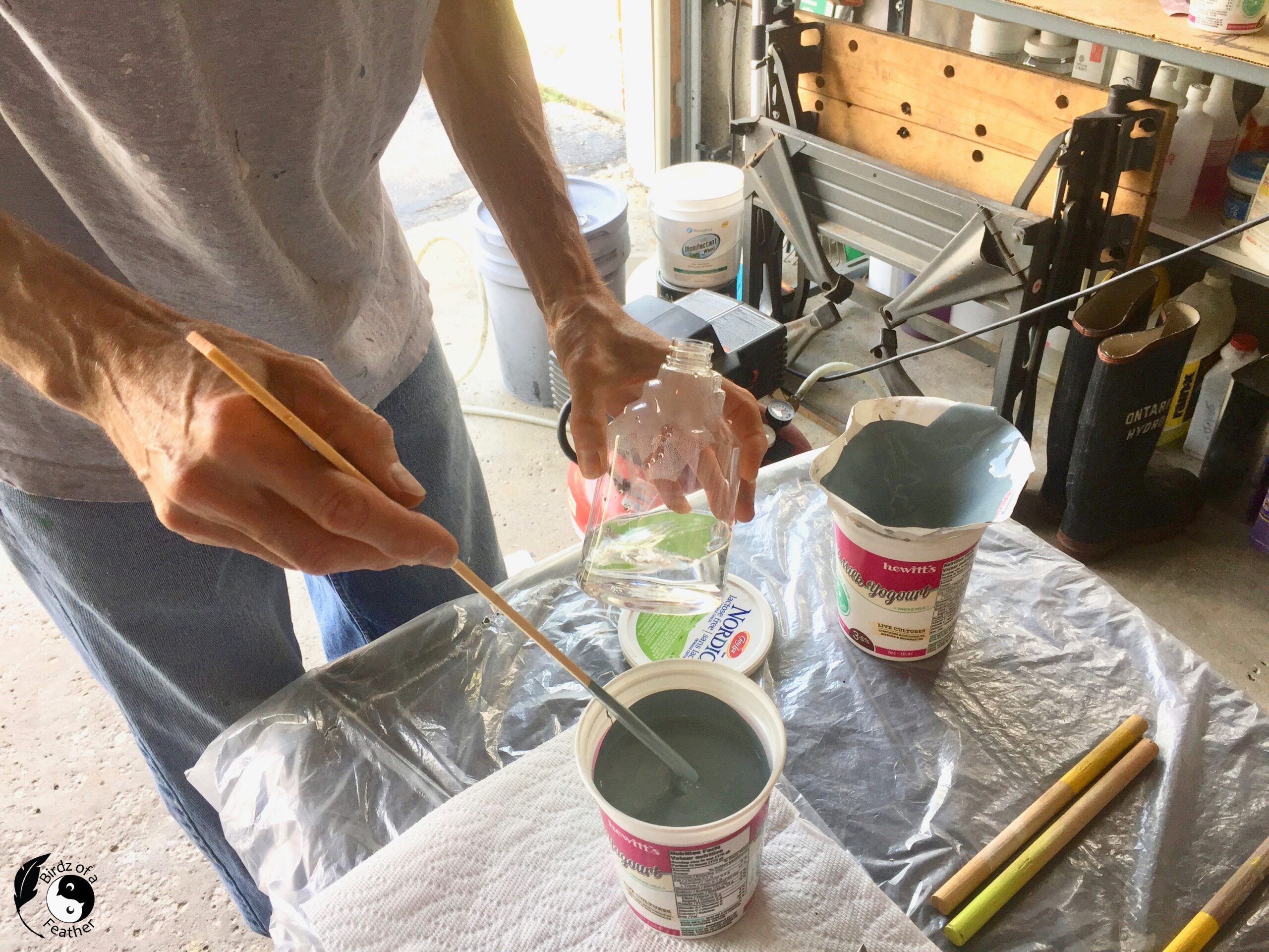 Watering down the paint to prepare for How to Paint Using a Spray Gun