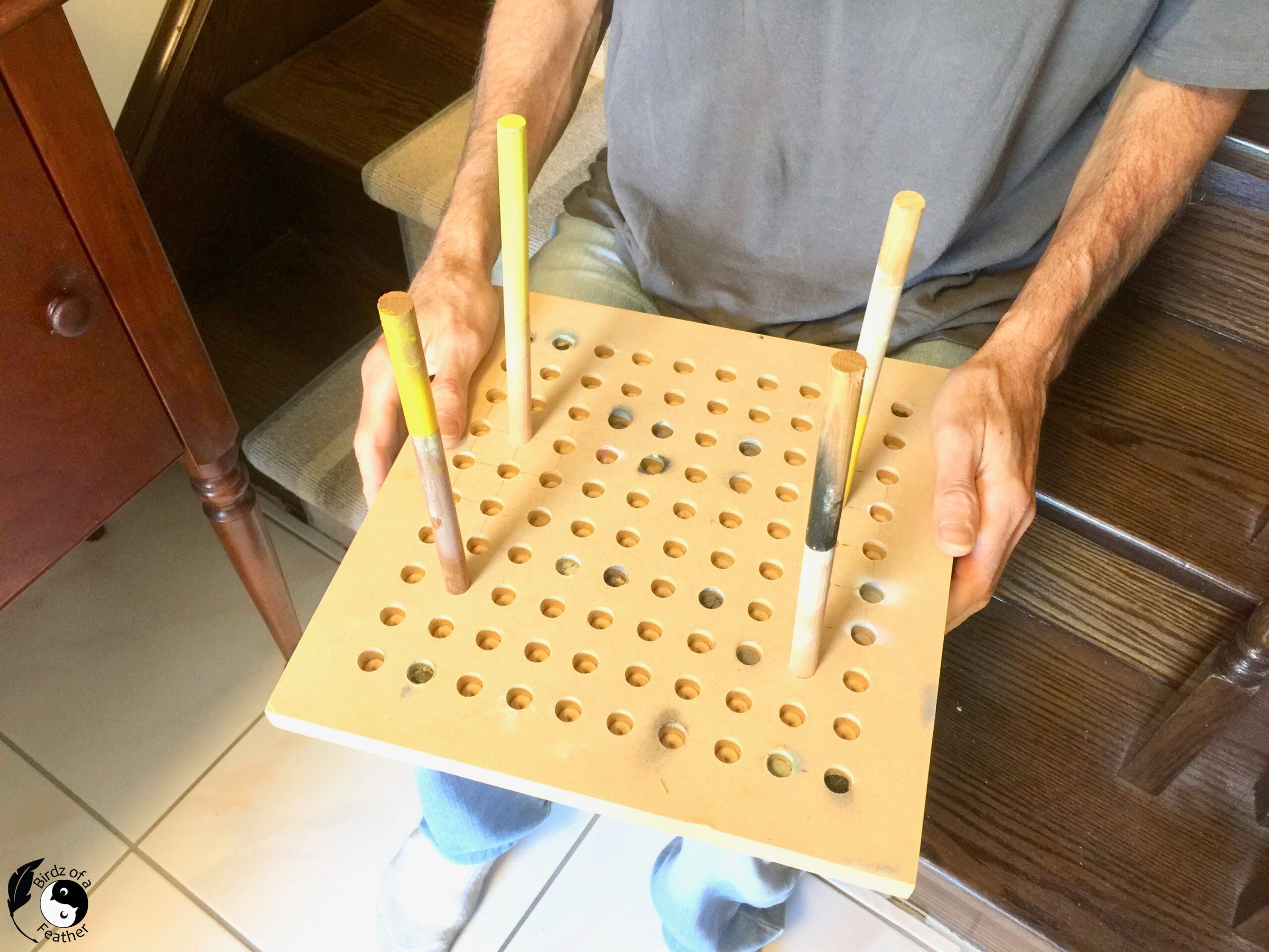 Paint jig with dowels for painting with a spray gun