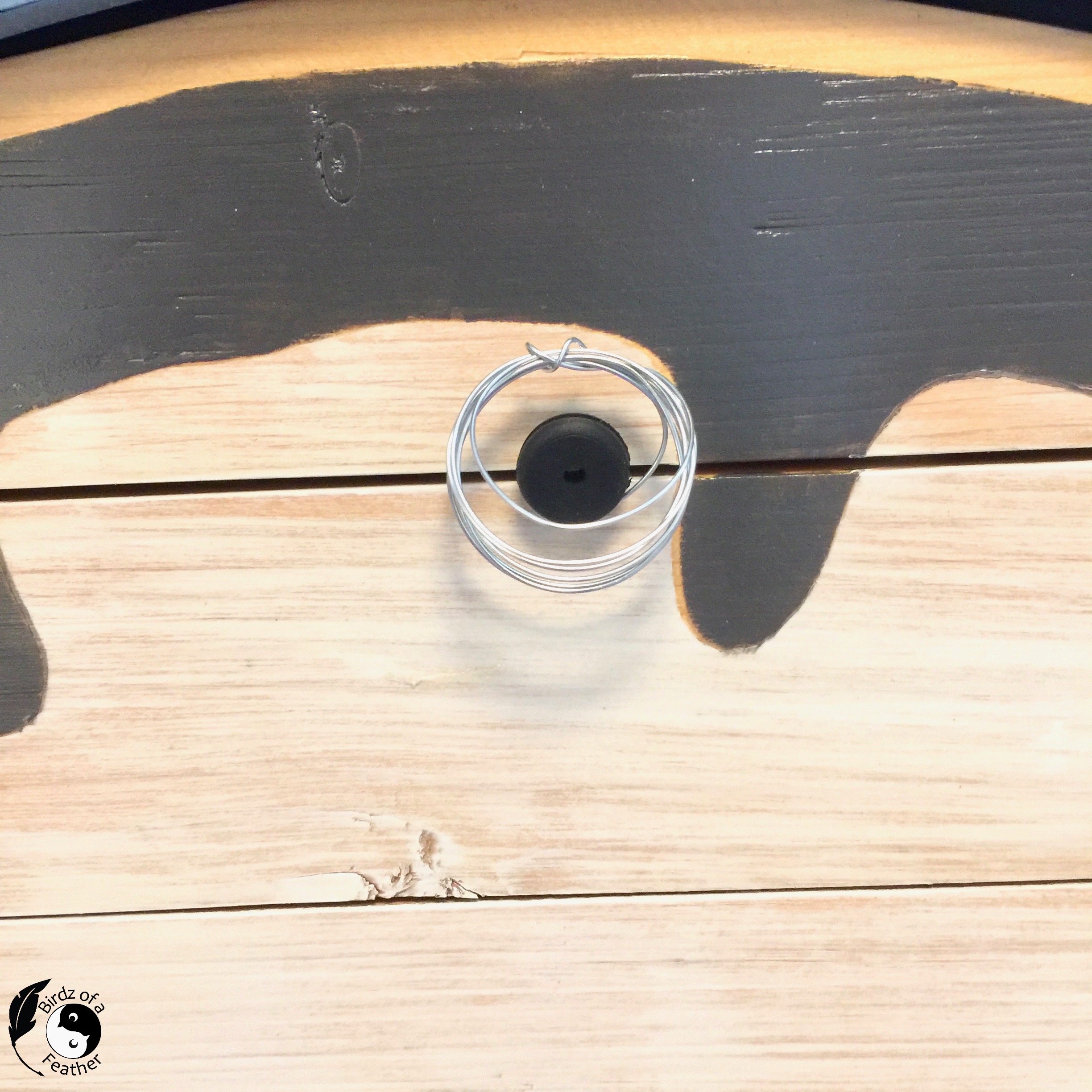 unique air plant holder attached to wooden surface of pallet clock with nano tape