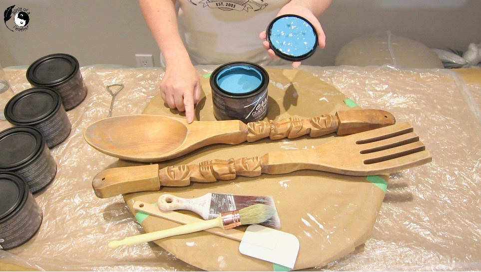 Open paint can showing cerulean blue clay paint