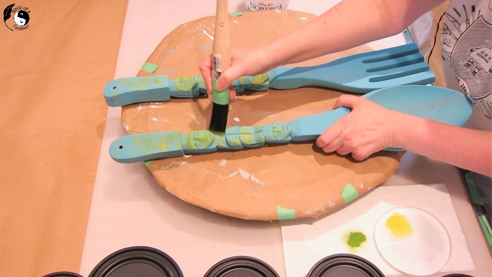 Dry brushing Daffodil Terra clay paint onto wooden spoon