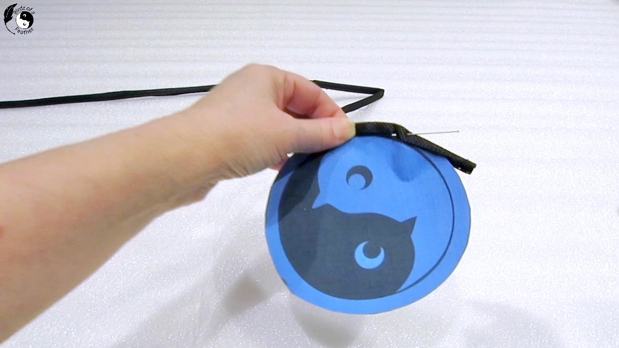 Emblem for front of sling water bottle bag