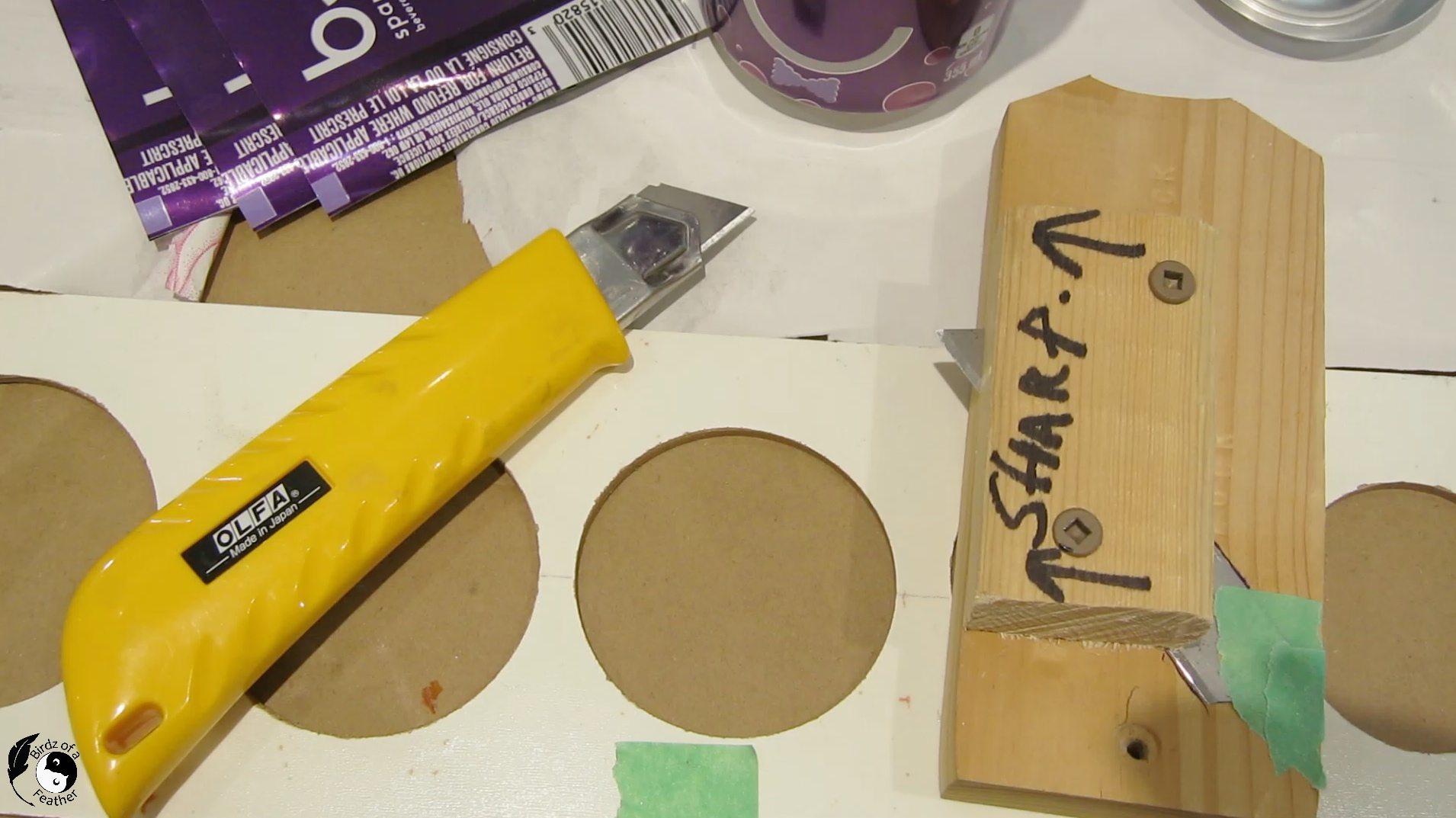 Our diy soda can craft cutting tool beside an olfa cutter