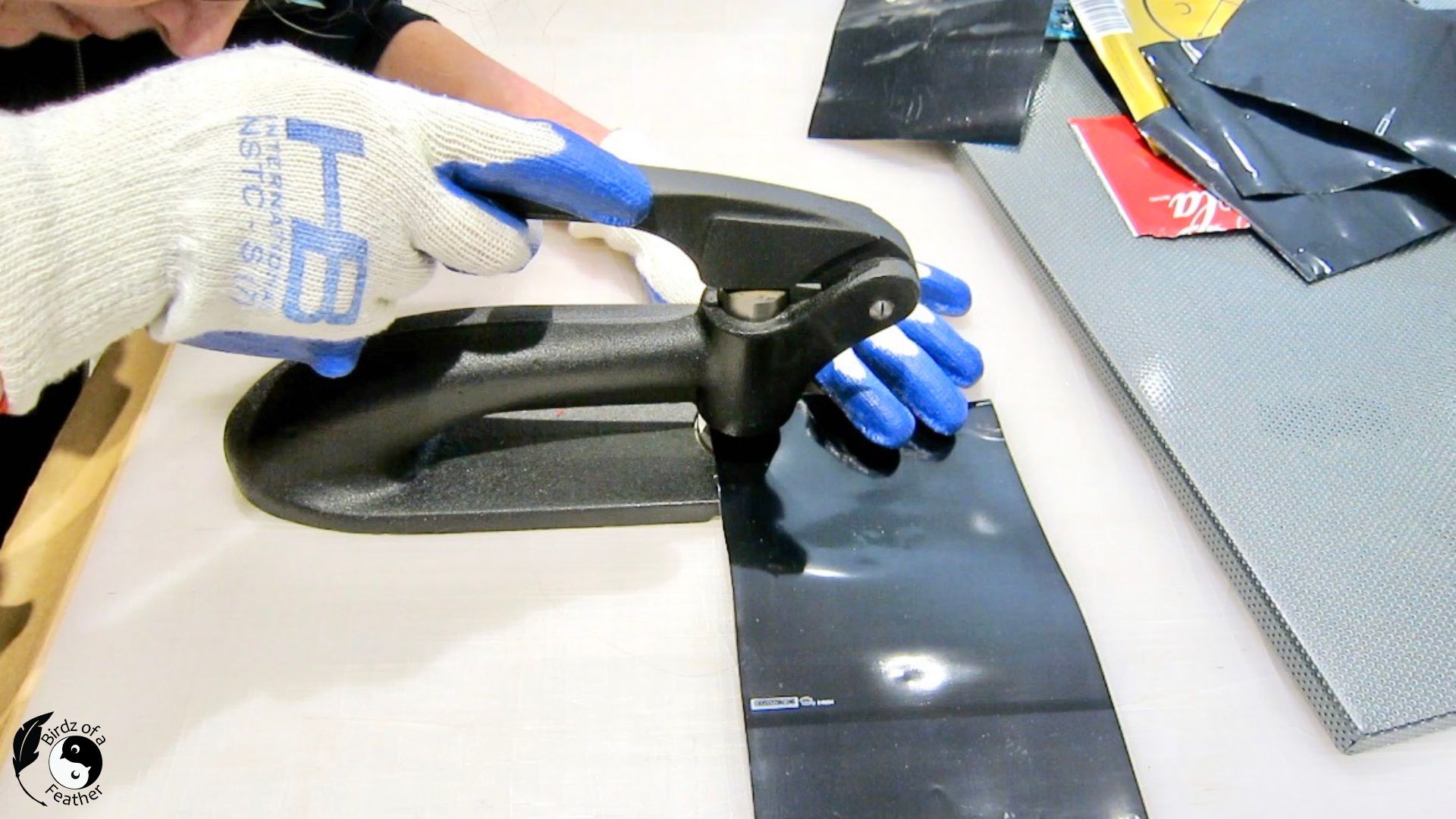 Punching circles with a rabbit punch for soda can craft