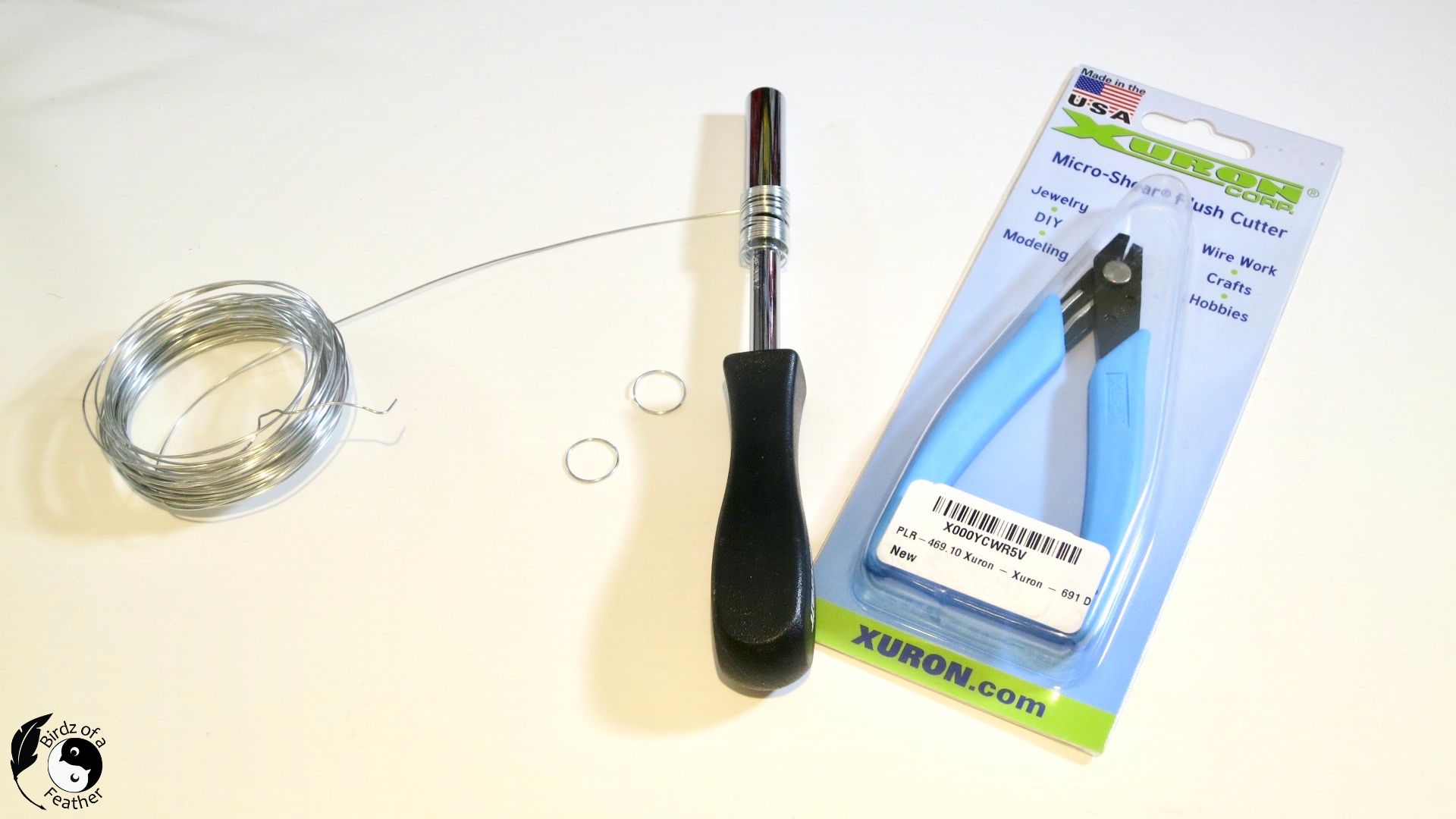 Wire wound around socket wrench with spool of wire and Xuron double flush cutters beside it