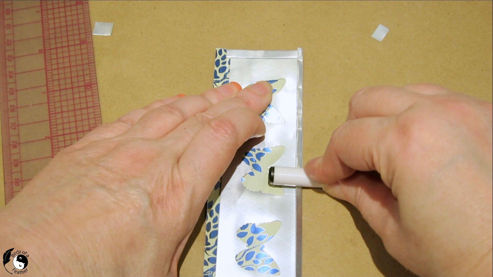 Using the side of a pen to burning the folded edge of the aluminum can