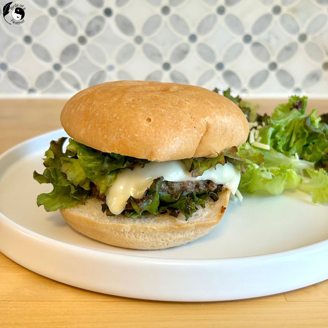 Mushroom beef burger on a plate with salad